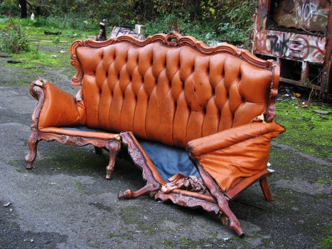 Skip hire truck parked on a residential street in Honor Oak